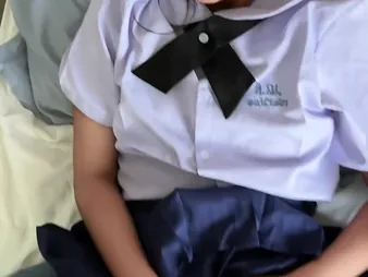 Watch Suwipha, a sexy Thai schoolgirl in all directions college uniform, take a fixed pounding from a thick milky pole